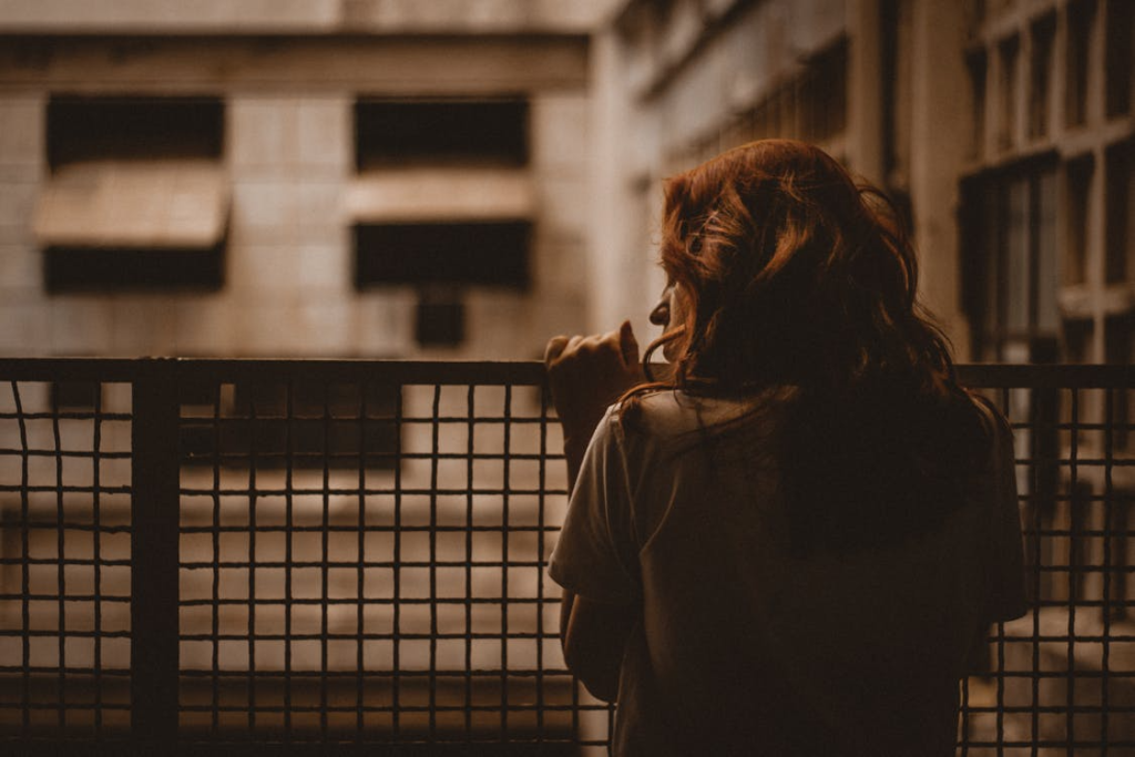 Woman Holding on Railings
