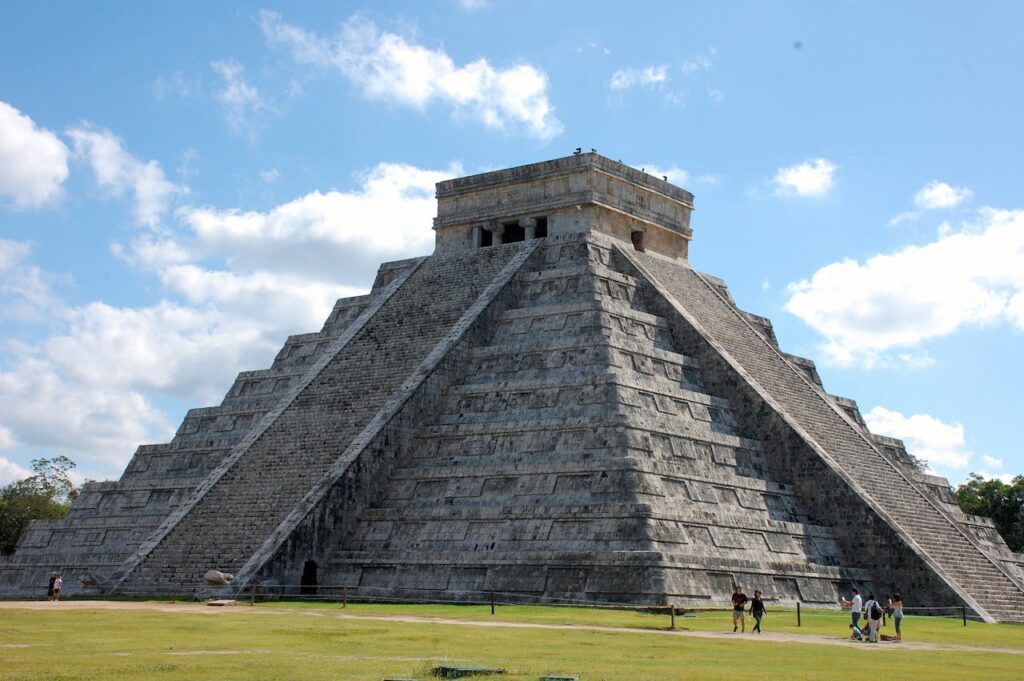 Tourist Walking Beside a Pyramid

