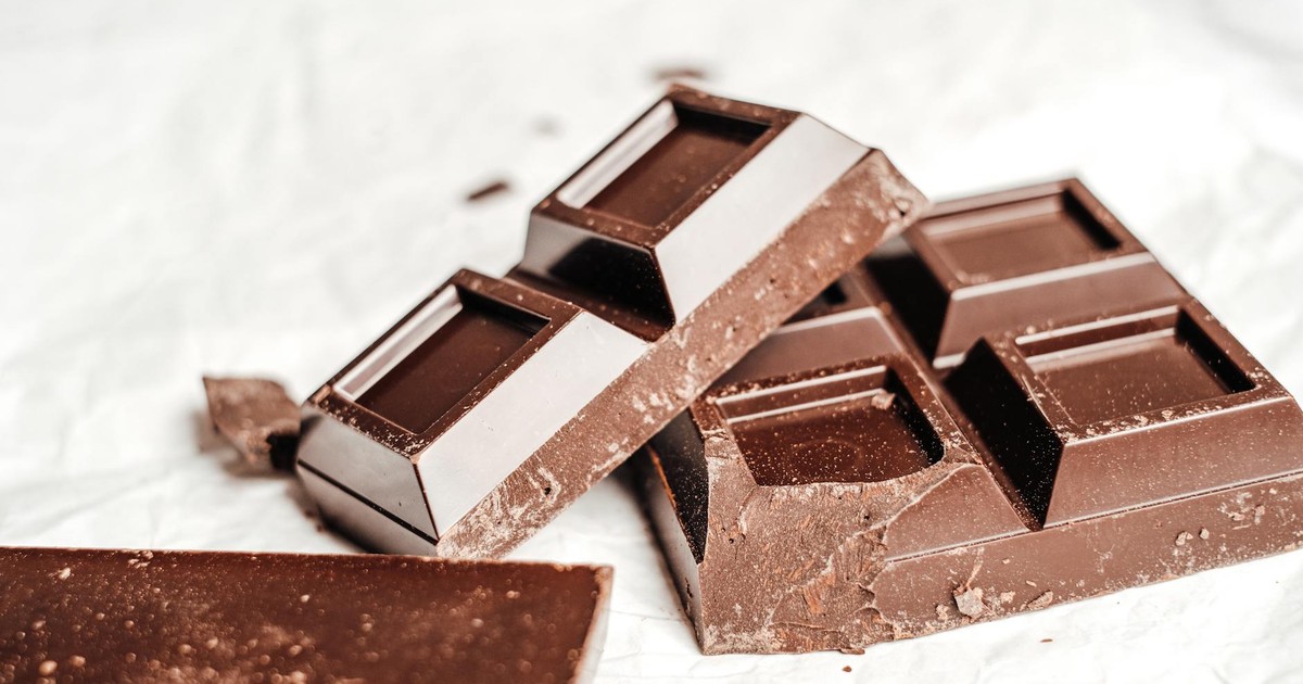 A close-up shot of gourmet dark chocolate bars on a white background. Perfect for food photography enthusiasts.