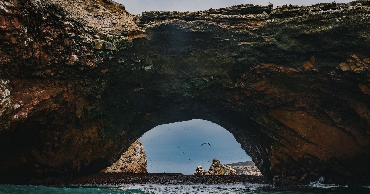 Explore the stunning natural rock arch in the coastal Ballestas Islands, Paracas, Peru.
