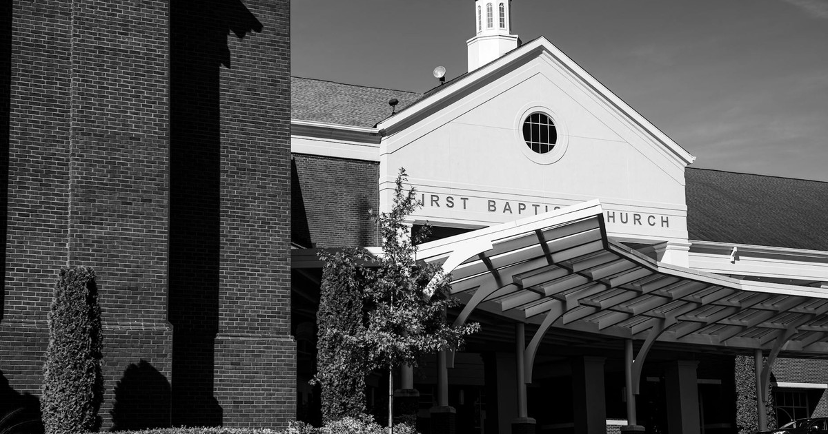 Black and white image of the First Baptist Church in Trussville, showcasing classic architecture.