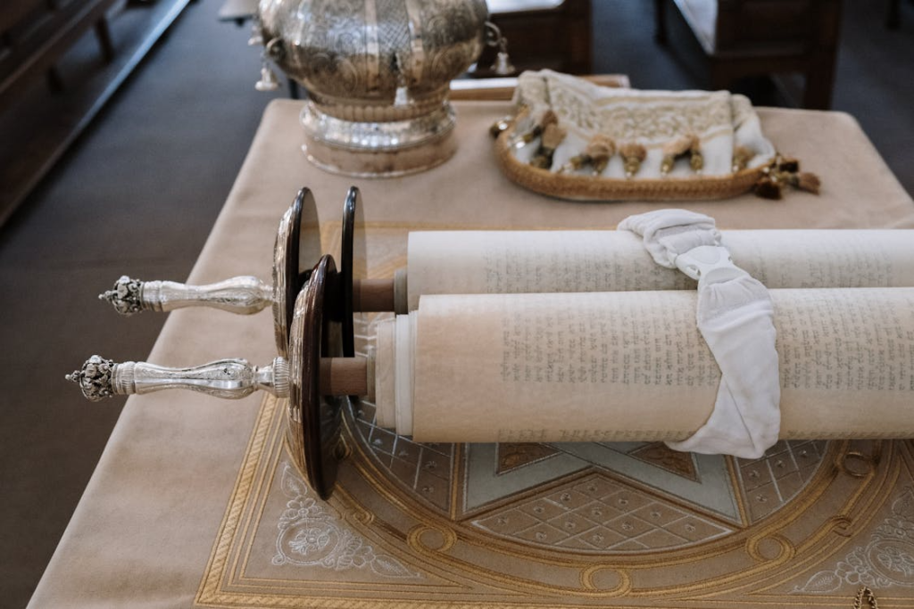Sefer Torah scroll displayed on a bimah in a synagogue setting, showcasing rich cultural heritage