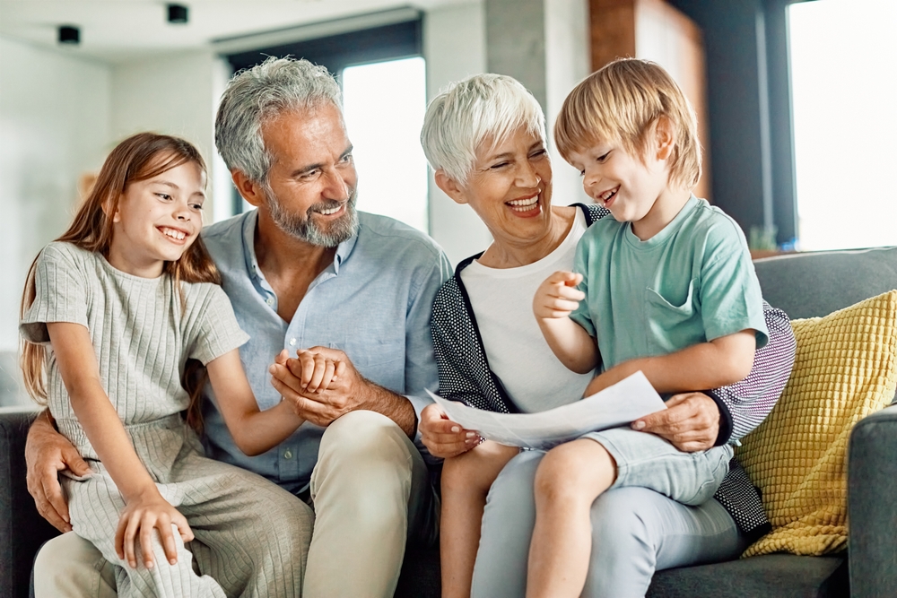 Portrait of grandparents and grandchildren having fun together at home