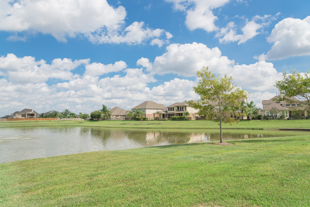 Residential houses by the lake in Pearland, Texas, USA.