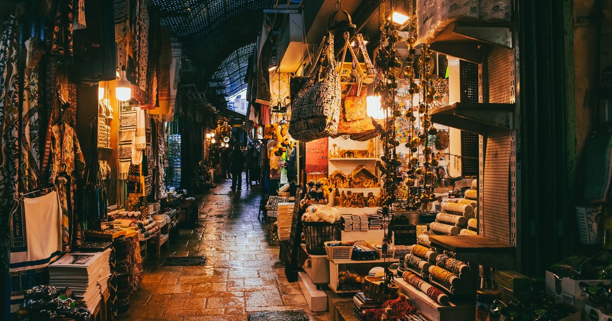 Explore the vibrant market streets of Jerusalem, capturing the essence of local commerce and culture.