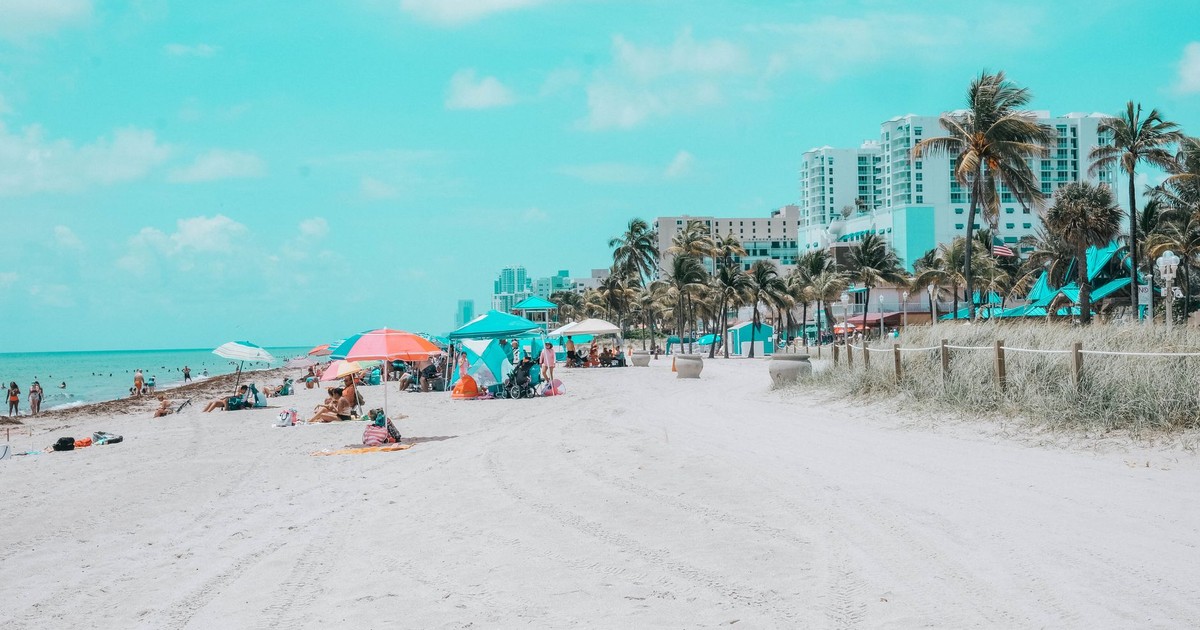 Relaxing seaside scene with colorful umbrellas on a sunny beach day. Perfect vacation spot.