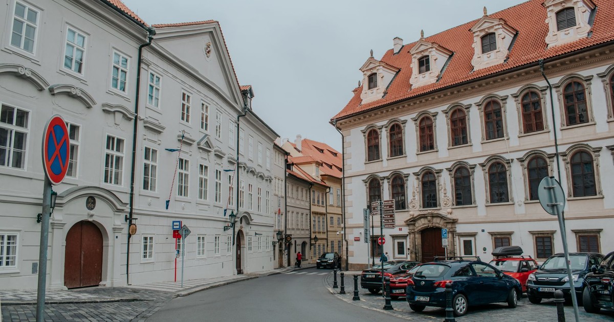 Cobbled street with classic European architecture in Prague, ideal for travel insights.