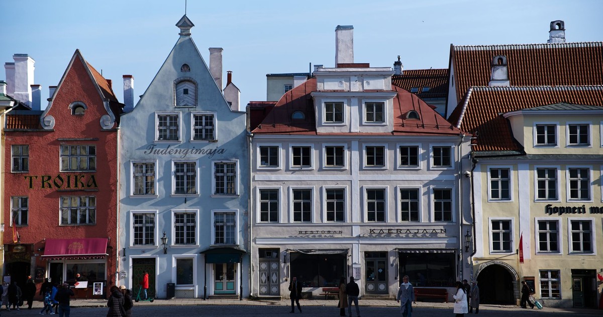 Charming historic buildings in Tallinn's Old Town square, a UNESCO World Heritage site.