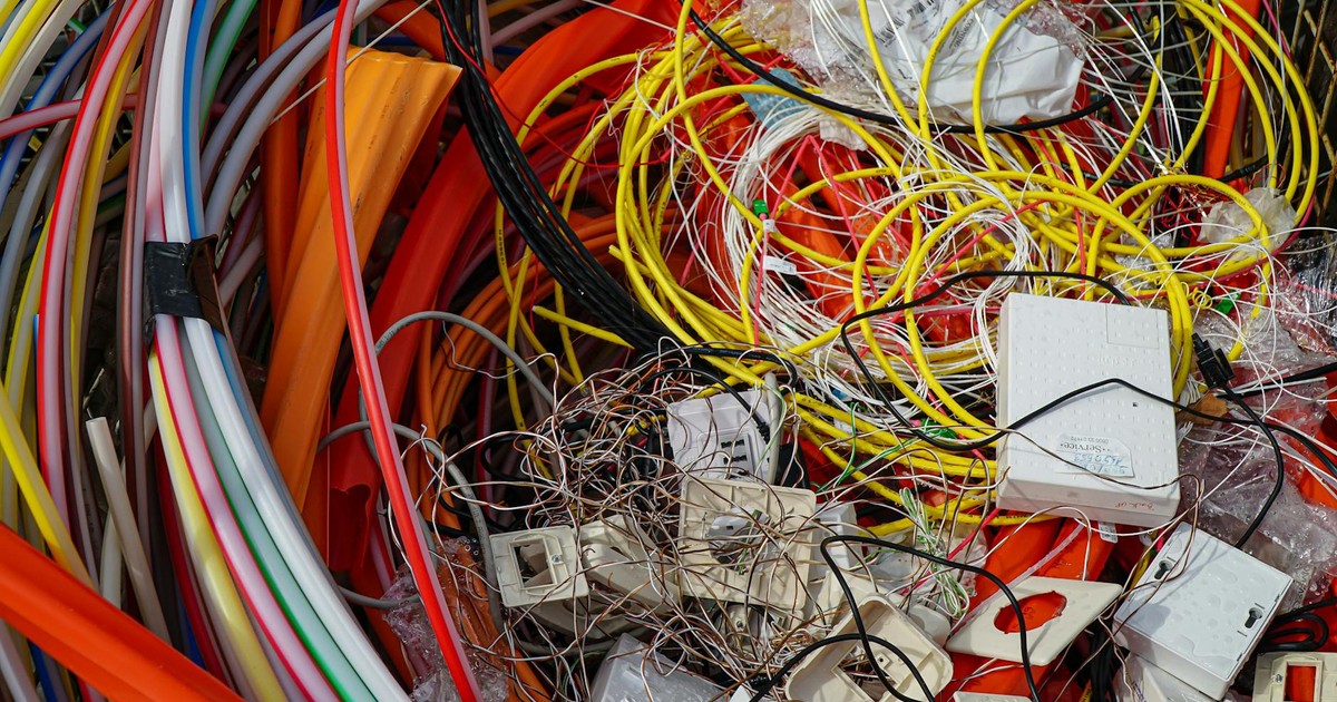 A vibrant mixture of electrical cables and waste ready for recycling.
