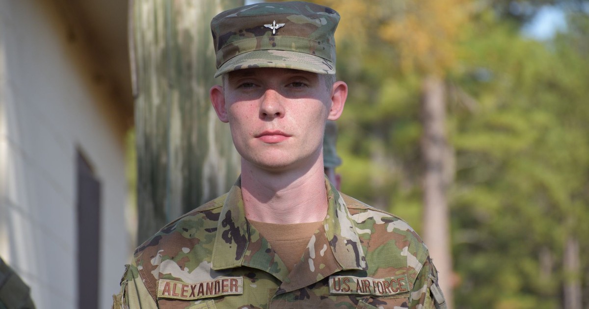 US Air Force soldier in camo uniform standing outdoors, facing camera.