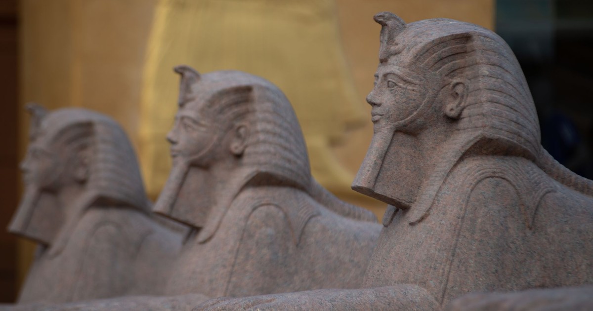 Close-up of stone sphinx statues in ancient Egyptian style, highlighting intricate carvings and details.
