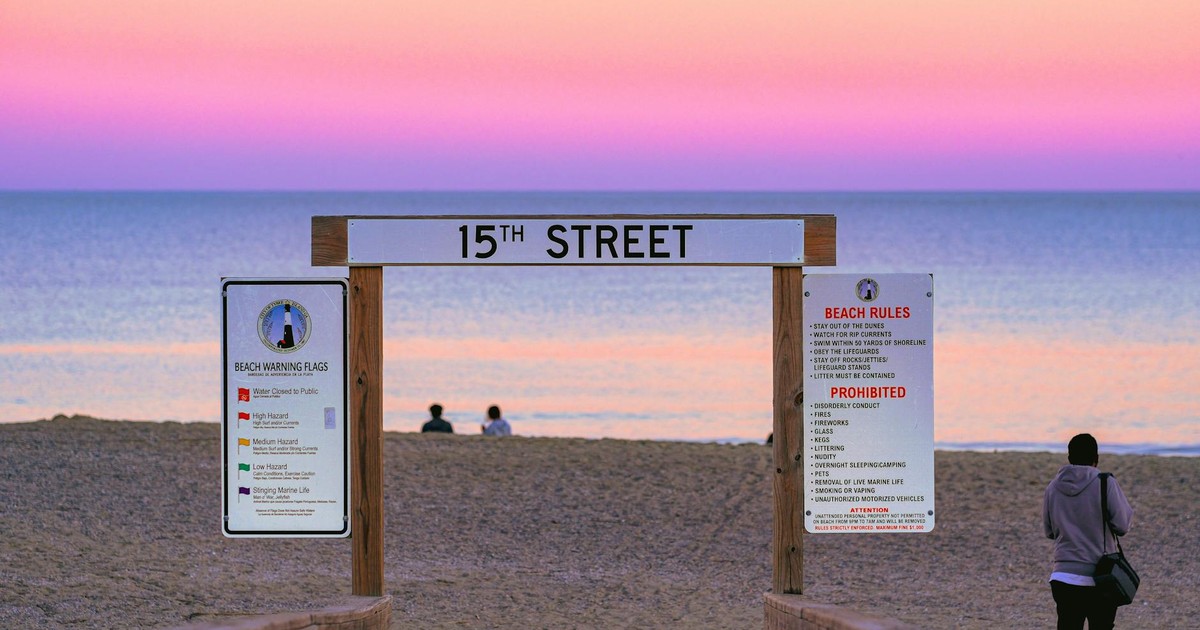 Peaceful evening at 15th Street Beach during a vivid sunset, capturing serene ocean views.
