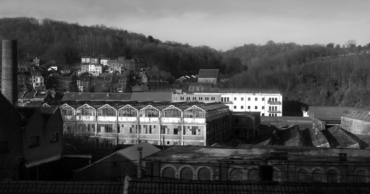 Moody black and white photo of abandoned industrial buildings in Wallonia, Belgium.