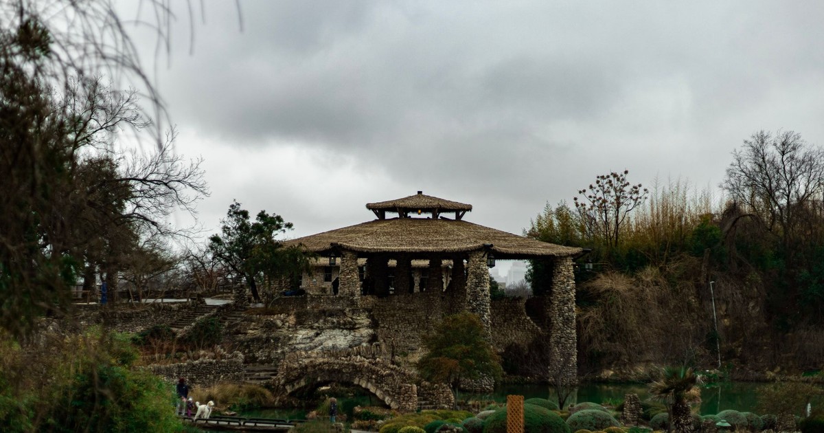 Capture of the historic Japanese Tea Garden in San Antonio, showcasing its tranquil stone architecture and lush surroundings.