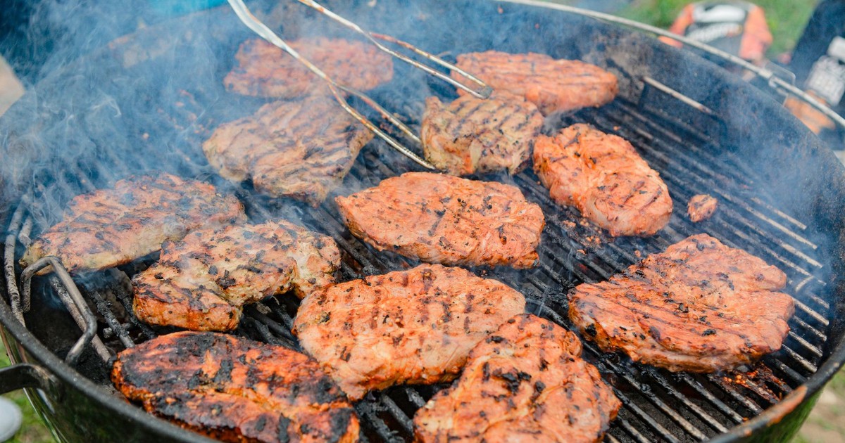 Grilling mouthwatering pork chops outdoors, showcasing delicious BBQ flavors.