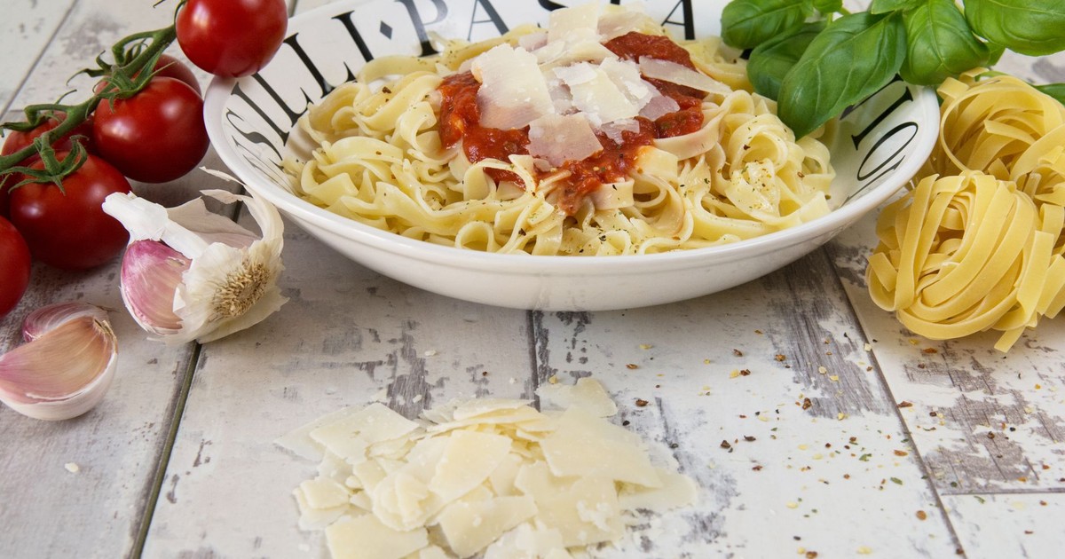 Tasty Italian pasta dish with tomato sauce, Parmesan cheese, and fresh ingredients.