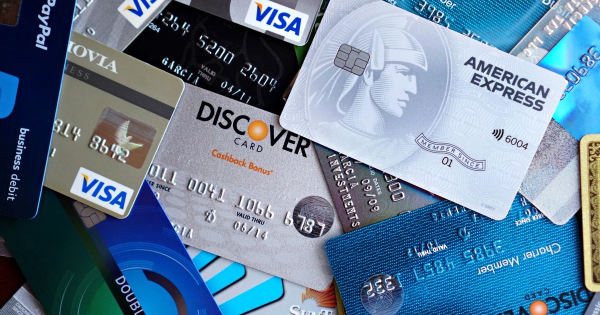 Close-up image of various credit cards including Visa, Mastercard, and American Express.