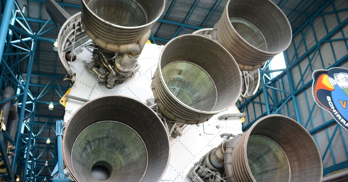 Close-up view of Saturn V rocket engines at Kennedy Space Center, highlighting intricate engineering.