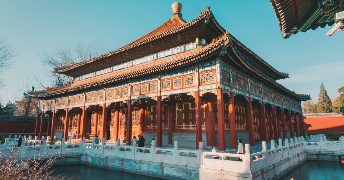 Ancient Chinese building in Beijing, featuring traditional architecture under a clear blue sky.