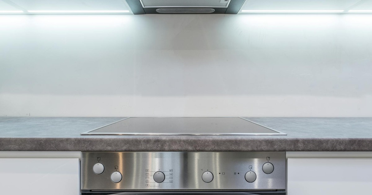 A sleek, modern kitchen with steel appliances and minimalist design.