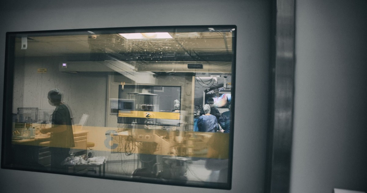 A glimpse into a surgery room, showcasing healthcare professionals at work.
