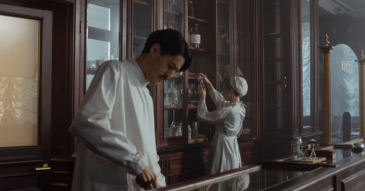 Historical science laboratory scene with researchers in vintage attire exploring shelves filled with glassware.