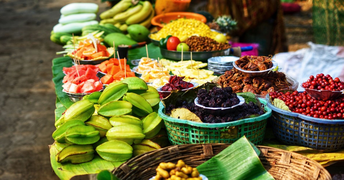 Colorful assortment of fresh fruits displayed for sale at a market stall.