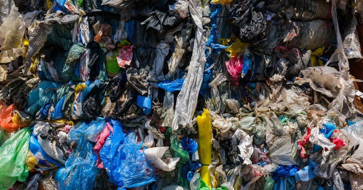 Close-up of compacted plastic waste ready for recycling, highlighting environmental issues.