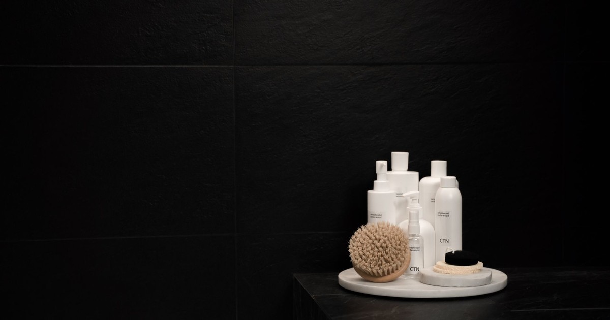 Elegant display of skincare products on a dark background, ideal for beauty marketing.