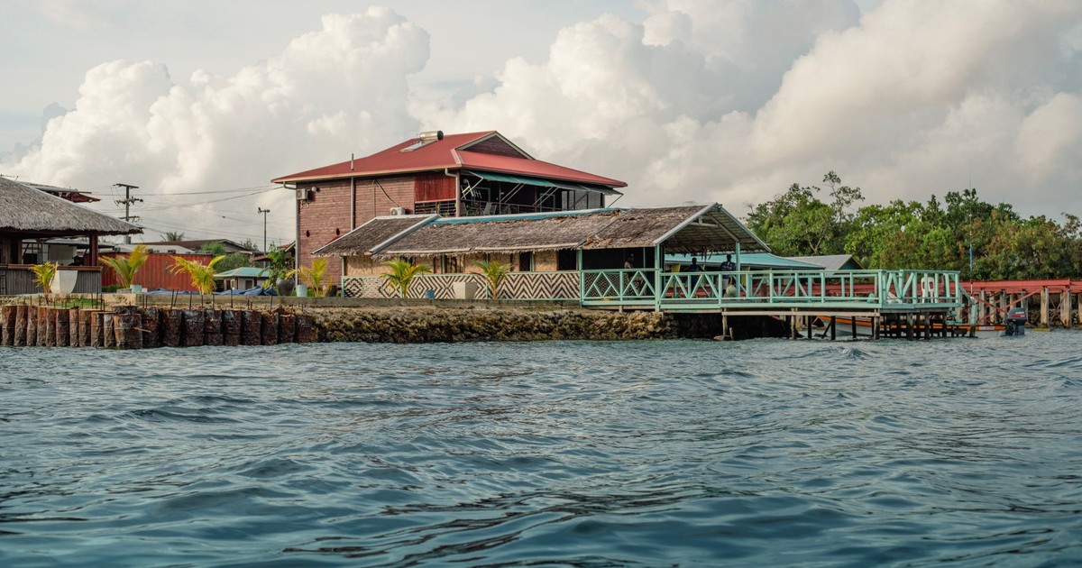 Charming waterfront lodge in Bougainville, Papua New Guinea, surrounded by lush scenery and peaceful waters.