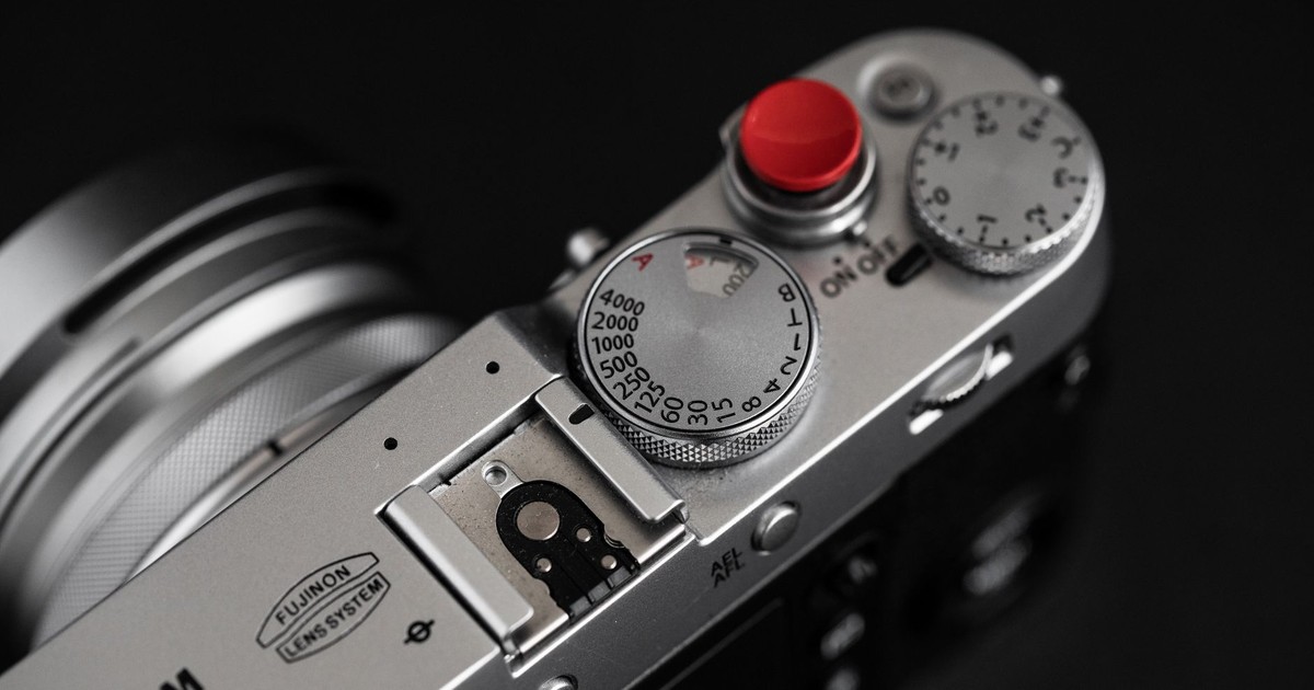 Detailed view of a vintage style camera's top, showcasing dials and buttons.