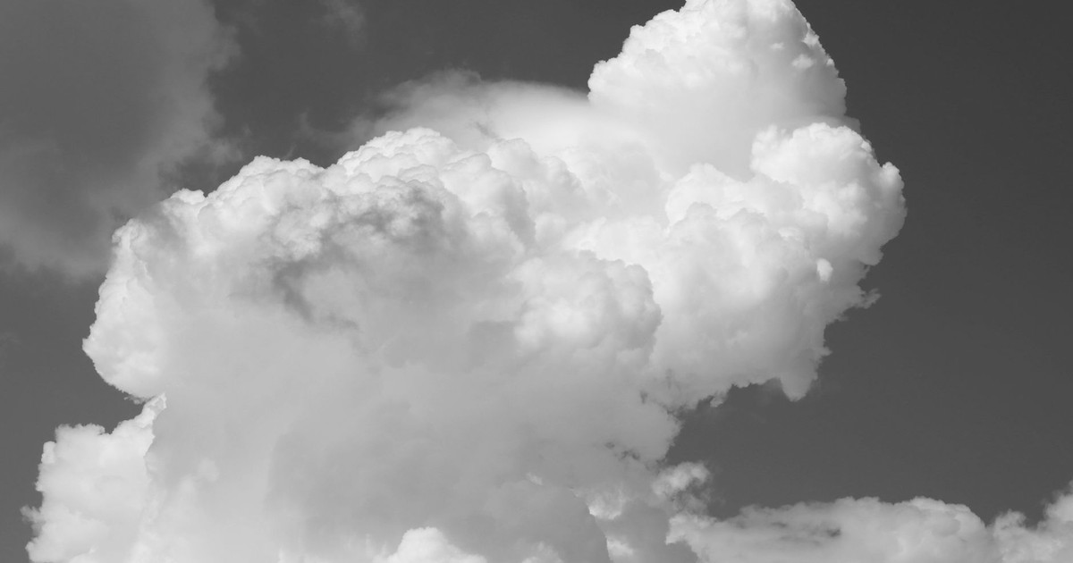 A striking image of cumulus clouds in the sky, captured in black and white in Palermo, Sicily.