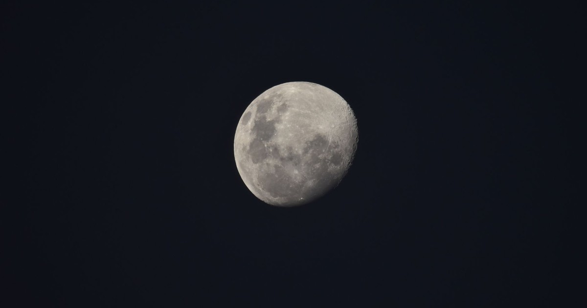 A detailed view of the waxing gibbous moon, highlighting its craters against a dark night sky.