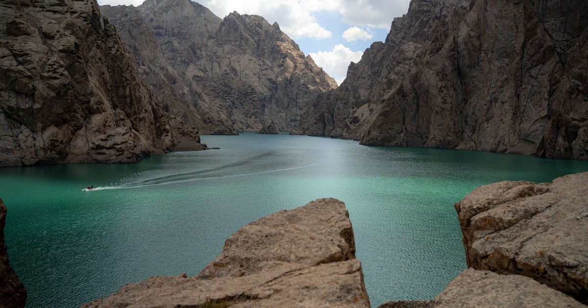 Discover the remote beauty of Kel Suu Lake in Kyrgyzstan's Naryn Region.