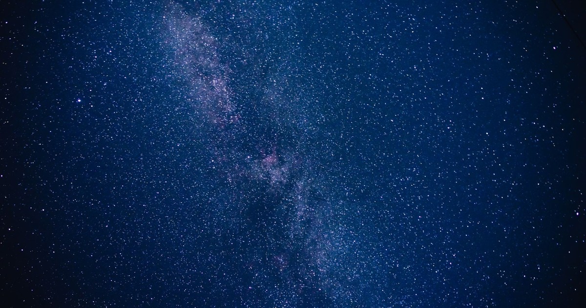 Capture the breathtaking beauty of the Milky Way galaxy with countless stars illuminating the night sky.