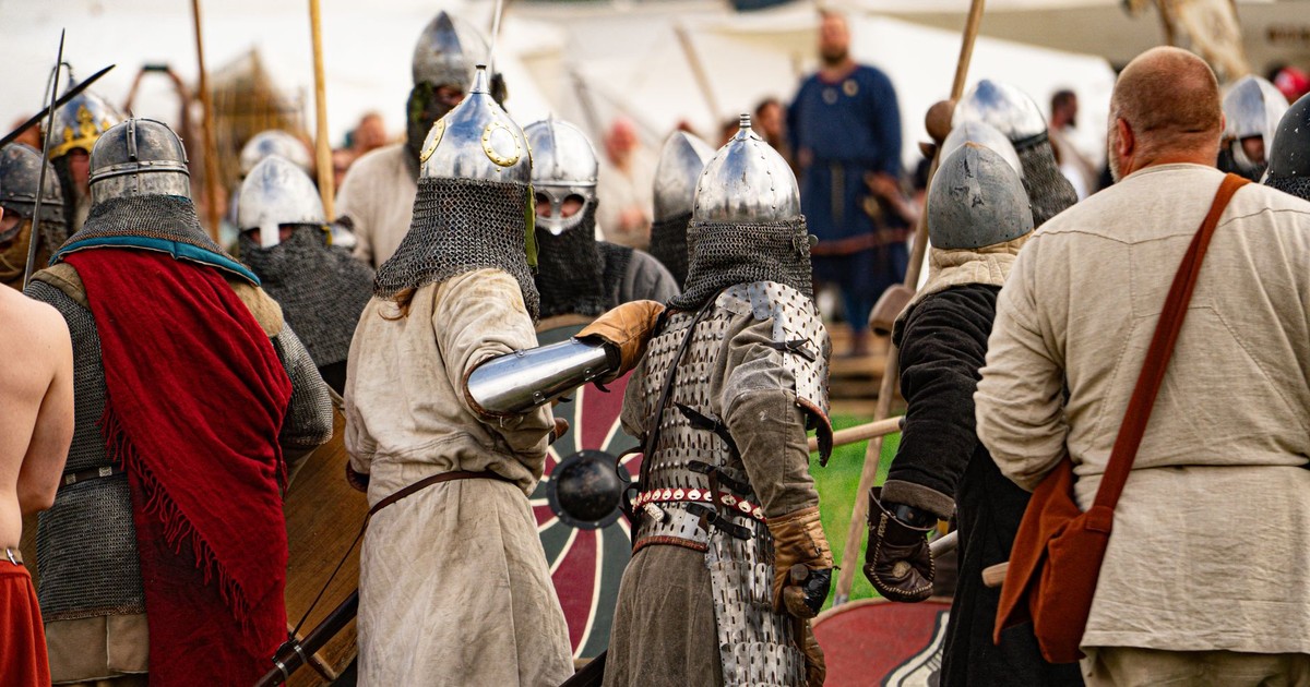 Viking warriors reenact a battle scene during a historical festival in Szczecin.