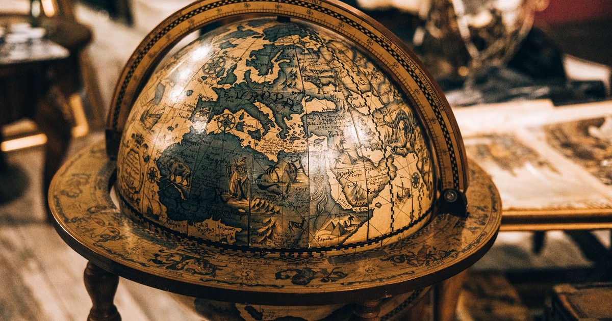 Close-up of an antique globe showcasing vintage cartography in a classic setting.