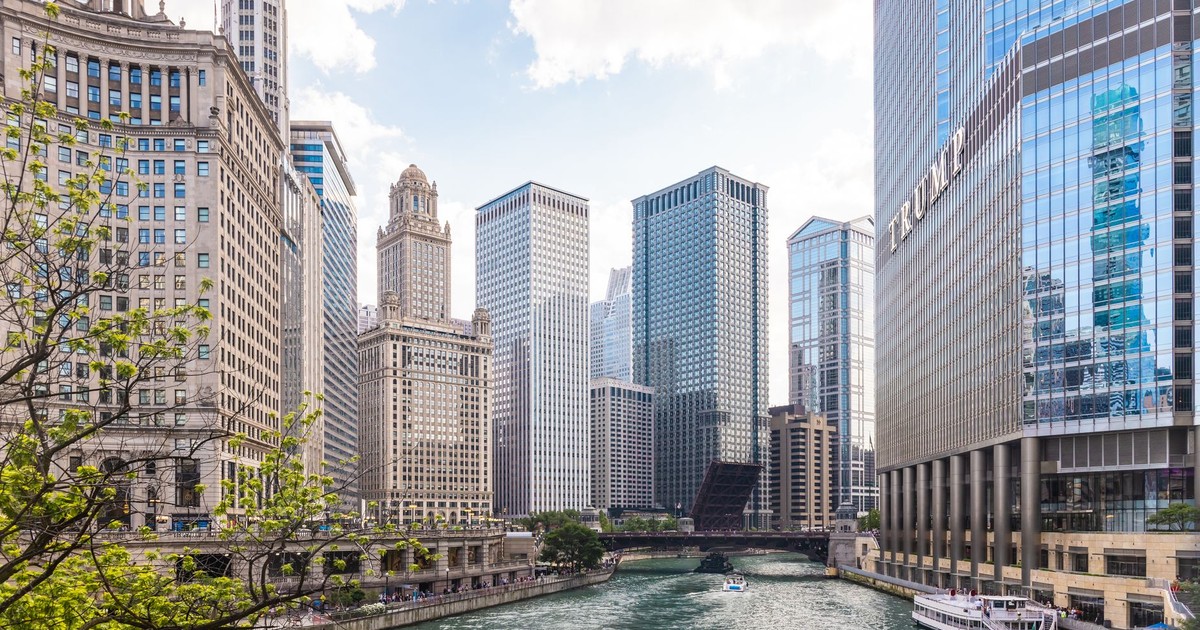 Captivating view of Chicago's iconic skyscrapers along the river on a clear day.