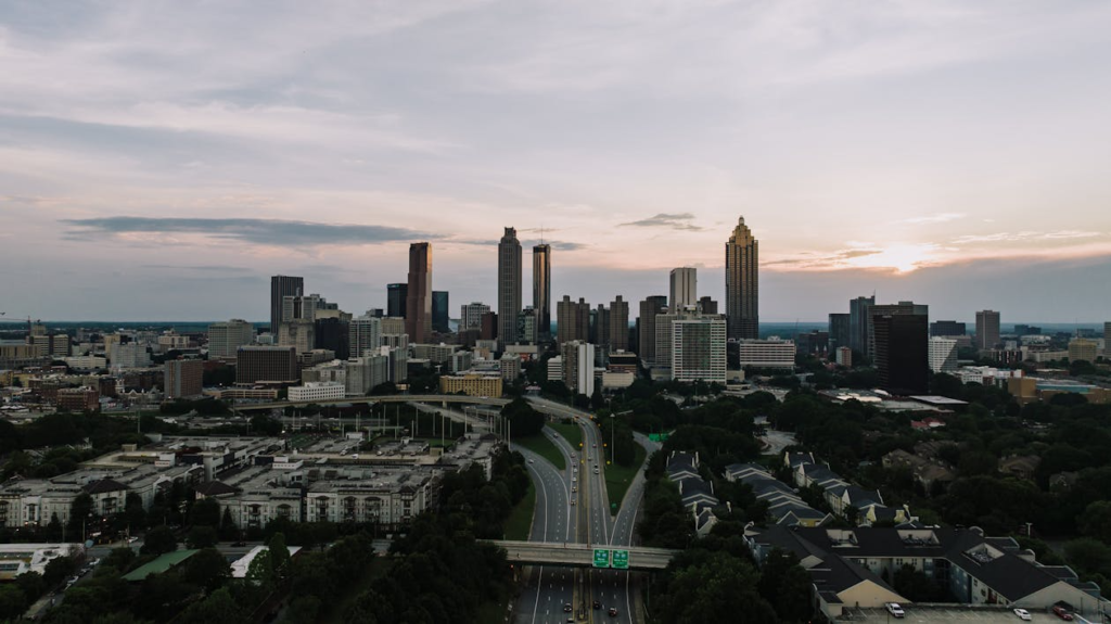 Captivating aerial view of the Atlanta skyline at dusk, showcasing the city's iconic skyscrapers and bustling highways