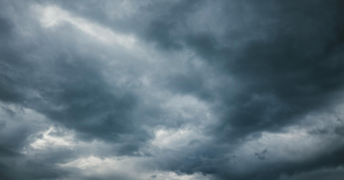Moody sky with thick storm clouds, capturing the essence of an approaching storm.