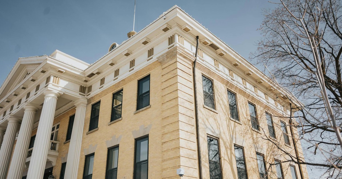 Low angle view of the historic Box Elder County Courthouse with columns and blue sky, Brigham City, Utah.