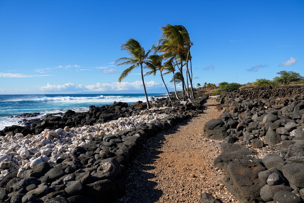 Rocky coastal trail path following the Pacific Ocean in the ancient fishing village in ruins of the Lapakahi State Historical Park on the island of Hawai'i (Big Island) in the United States