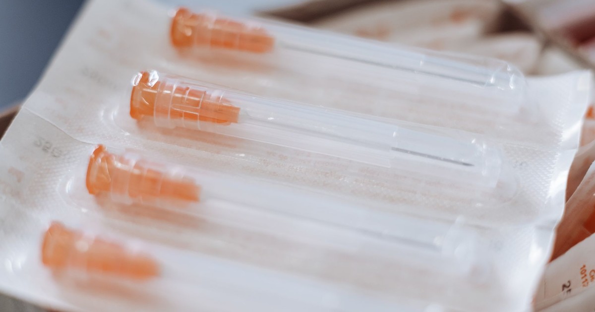 Close-up of sterile syringes in packaging, ideal for healthcare and medical use.