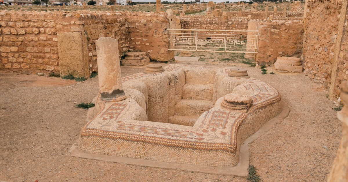 Explore ancient Roman ruins featuring intricate mosaics in Tunisia, capturing historical architecture and culture.