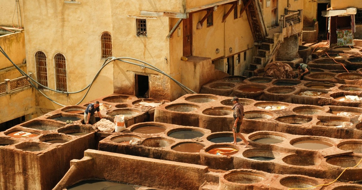 Explore the vibrant and historic tanneries of Fes, Morocco, showcasing traditional leather-making processes.