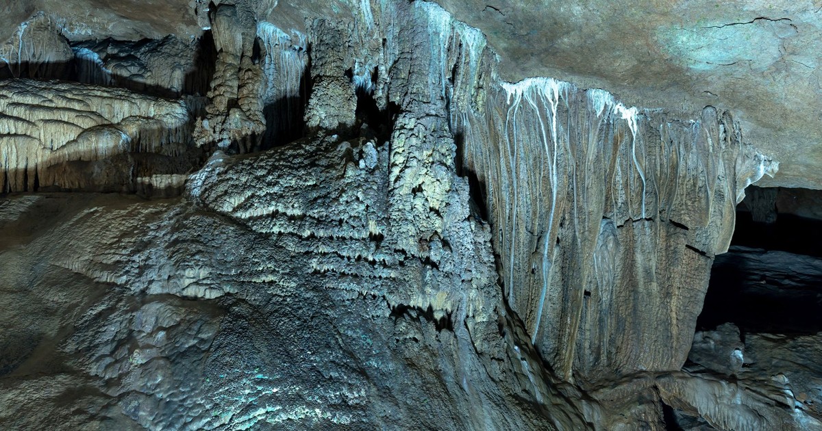 Explore stunning stalactites and stalagmites in a breathtaking cave setting.