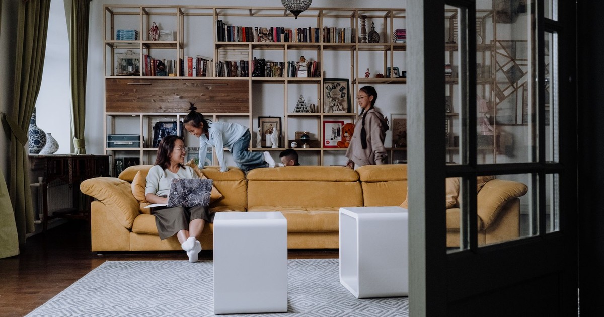 A family enjoying quality time together in a cozy and modern living room setting.