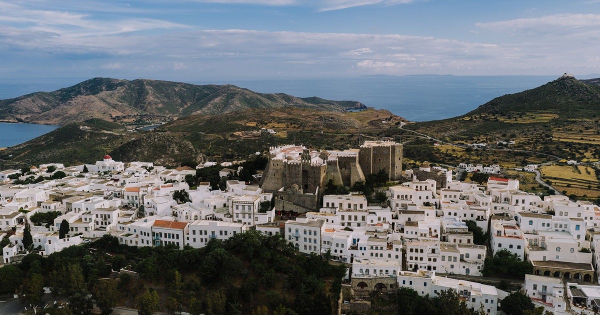 A stunning aerial capture of Patmos, Greece, showcasing traditional white buildings and historical landmarks.