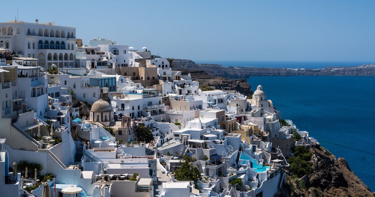 Discover the beauty of Santorini's white-washed buildings against the blue Aegean Sea.