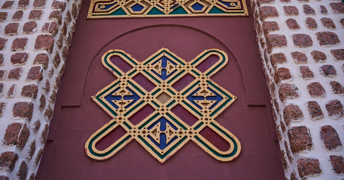 Close-up of ornate geometric patterns on a traditional building exterior showcasing craftsmanship.